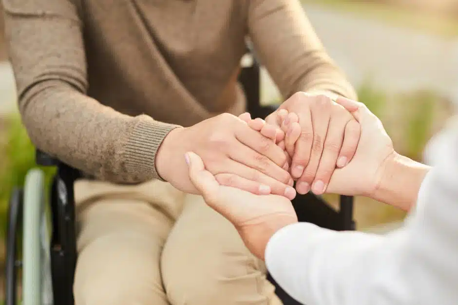 Image of someone in a wheelchair holding hands with another, Am i eligible for SSDI