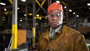 African American worker in fabrication shop