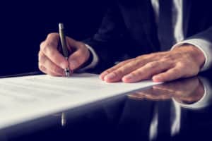 Nursing-Home-Abuse-Lawyer-Chicago-IL-lawyer-writing-document.