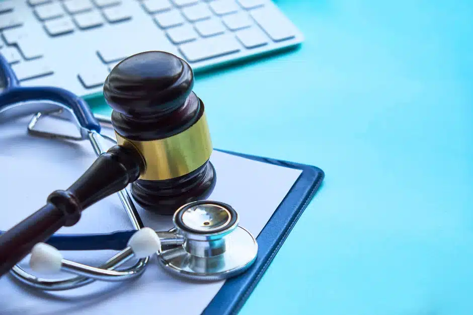 How to prove medical malpractice, image of gavel next to stethoscope, Disparti Law Group Accident & Injury Lawyers 