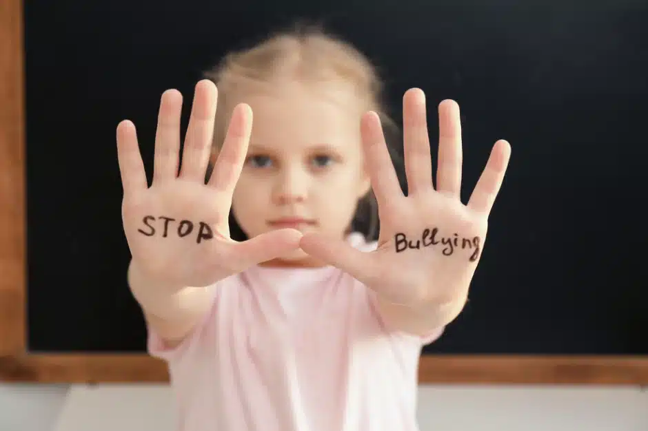 Bullying Prevention, image of girl with stop bullying written on palms