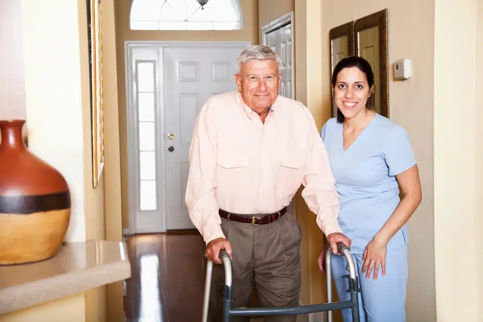 SEIU members, image of health care aide assisting elderly man with walker