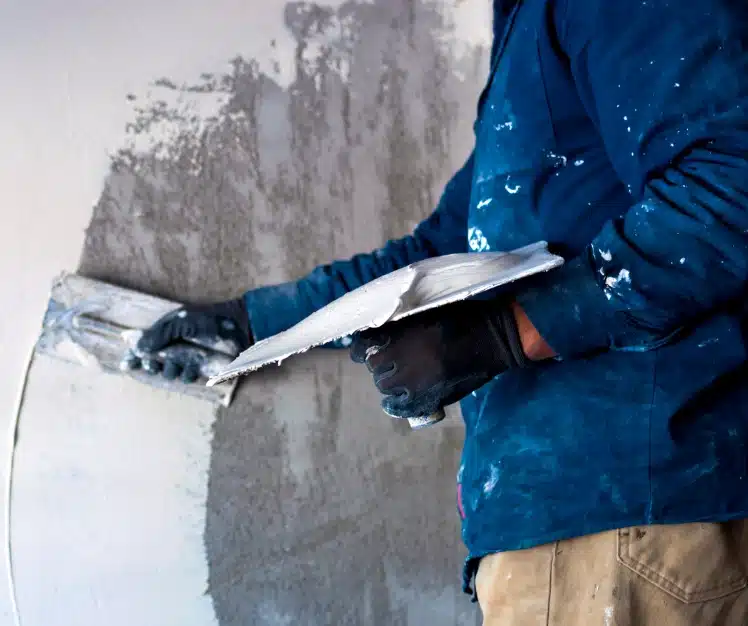 OPCMIA members, image of plasterer working on wall