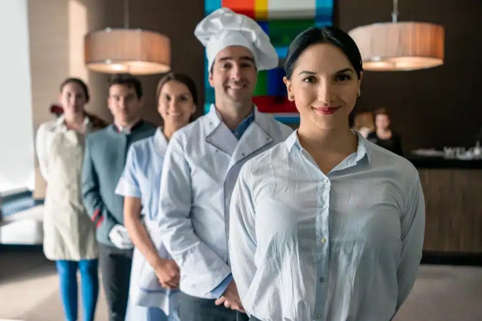 UNITE HERE union, image of service industry workers lined up smiling