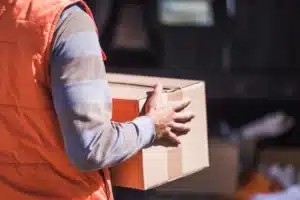 Victories for teamsters, delivery man holding box 