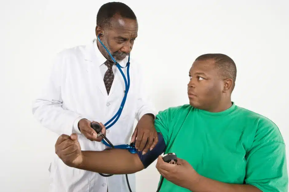 IMe doctor checks patient blood pressure