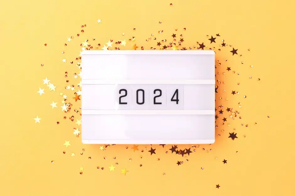New illinois laws for 2024, image of a sign reading 2024 with gold star confetti around it