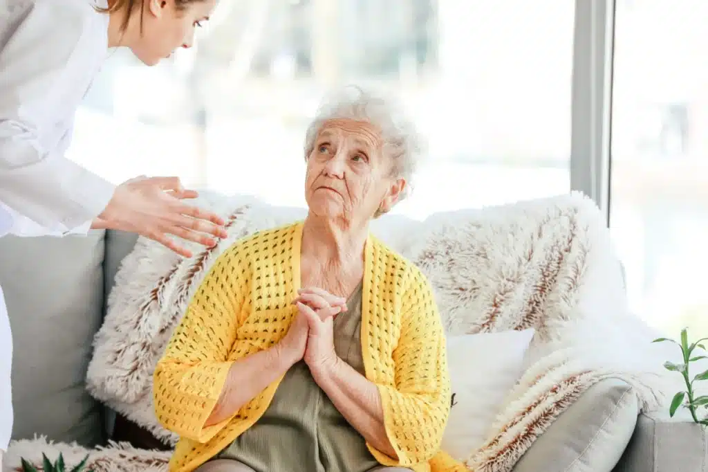 Nursing home complaint illinois, image of elderly woman looks distraught being yelled at by nurse, Disparti Law Group